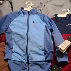 Boys tracksuits selling both for 50.00